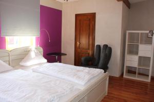 Postel nebo postele na pokoji v ubytování Hotel Turmdieb