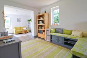 a living room with a couch and a table at MODERN HOLIDAY HOME central St Merryn in St Merryn