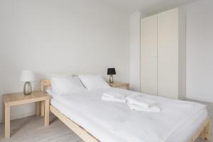 Apartments Poznań Atal Maltaにあるベッド