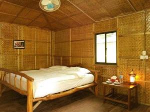 Кровать или кровати в номере Soe Ko Ko Beach House & Restaurant