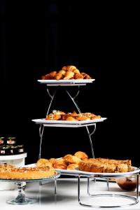 a three tiered display of food on three tiers at Dar El Marsa Hotel & Spa in La Marsa