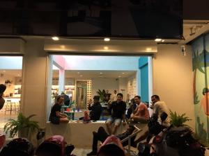a group of people sitting in front of a building at Borbaboom Phuket Poshtel & Hostel SHA in Phuket