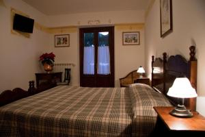 Postel nebo postele na pokoji v ubytování LH Albergo il Paradiso