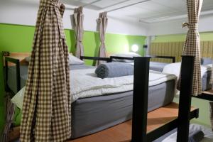 Ein Bett oder Betten in einem Zimmer der Unterkunft Tangmo House