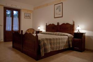 Postel nebo postele na pokoji v ubytování LH Albergo il Paradiso