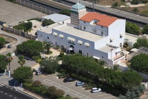 an aerial view of a building with a parking lot at Hotel Vecchio Mulino in Monopoli