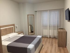 Posteľ alebo postele v izbe v ubytovaní Hotel Celanova