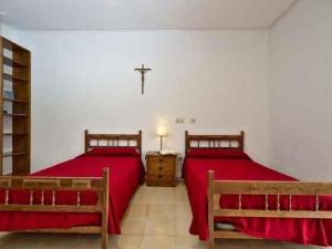 Postel nebo postele na pokoji v ubytování Monasterio El Olivar