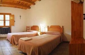 Postel nebo postele na pokoji v ubytování Monasterio El Olivar