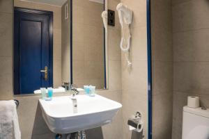 a bathroom with a sink and a mirror and a toilet at Alda Jolio Jaca in Jaca +76 photos