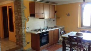 Kuchyňa alebo kuchynka v ubytovaní Podere I Casaloni - La casa nel bosco