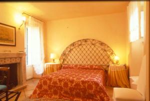 a bedroom with a large bed with a red blanket at Locanda di Porta Antica in San Benedetto del Tronto