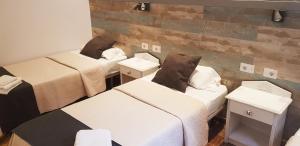 A bed or beds in a room at Hotel Horizonte