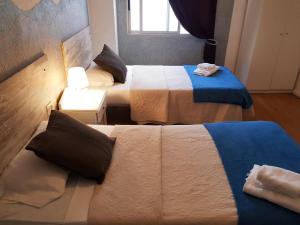 A bed or beds in a room at Hotel Horizonte