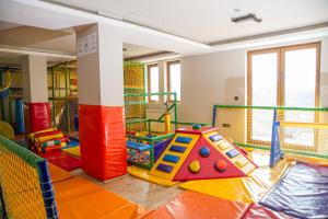 a room with a play room with a play equipment at Apartman Vlada b14 in Kopaonik