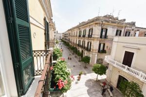 a view of a city street from a balcony at Alsecondopiano B&B in Gioia del Colle