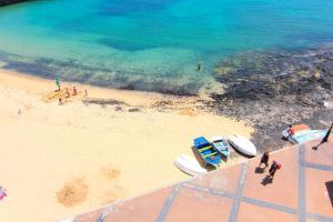 an aerial view of a beach with boats on it at AVANTI Lifestyle Hotel - Only Adults in Corralejo