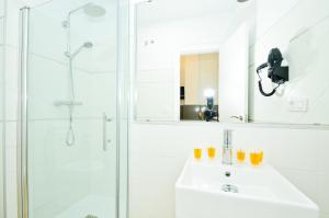 Kúpeľňa v ubytovaní NineSuites