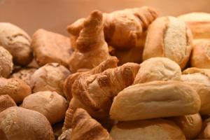 a pile of croissants and pastries are arranged at meinHotel in Hamburg