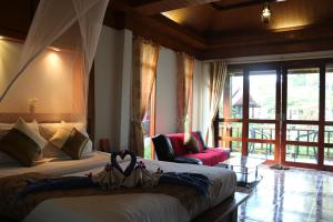 Postel nebo postele na pokoji v ubytování Rasa sayang Resort - SHA Certificate