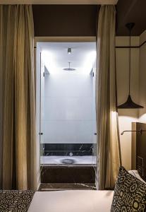 Postel nebo postele na pokoji v ubytování Corso 281 Luxury Suites