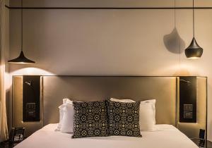 Postel nebo postele na pokoji v ubytování Corso 281 Luxury Suites