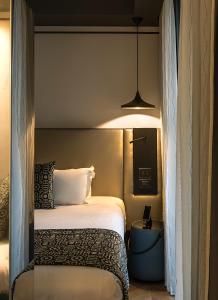 Postel nebo postele na pokoji v ubytování Corso 281 Luxury Suites