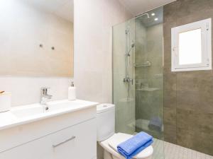 a bathroom with a shower and a sink and a toilet at Apartment Velazquez-3 by Interhome in Roses