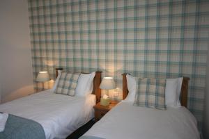 A bed or beds in a room at The Tennyson 