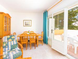 a dining room with a table and chairs at Apartment Velazquez-4 by Interhome in Roses