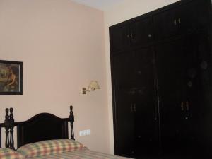 Łóżko lub łóżka w pokoju w obiekcie Hostal San Luis