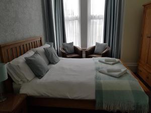 A bed or beds in a room at The Tennyson 