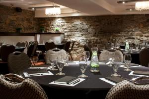 a dining room with a table and chairs at Auberge du Vieux Port by Gray Collection in Montreal