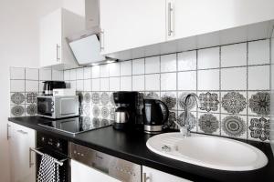 Kuchyňa alebo kuchynka v ubytovaní Familien Appartement "Ostsee Perle" neu & modern