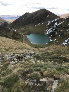 a tarn on the side of a mountain at Hostellerie de La Poste in Oust