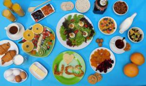 a table filled with different types of food at Urban Central Suites - Beirut in Beirut +82 photos