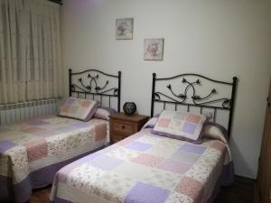 Postel nebo postele na pokoji v ubytování Casa Rural Mirador del Valle