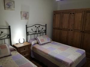 Postel nebo postele na pokoji v ubytování Casa Rural Mirador del Valle