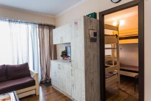 a small room with a room with a bunk bed at APT 7 Mgzavrebi in Bakuriani