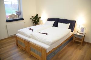 Postel nebo postele na pokoji v ubytování Resort Rybníček