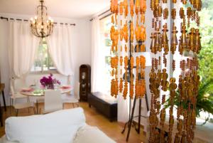 a living room with a bunch of glass chandeliers at Villa Alegre Playa Calpe Grupo Terra de Mar, alojamientos con encanto in Calpe