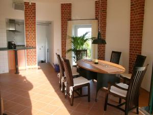 a dining room with a table and chairs at Wasserturm Cuxhaven in Cuxhaven