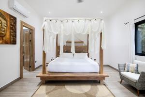 A bed or beds in a room at Bodhi Tree Yoga Resort