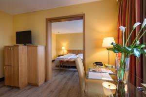 Ein Bett oder Betten in einem Zimmer der Unterkunft relexa hotel Stuttgarter Hof