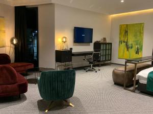 TV a/nebo společenská místnost v ubytování Hotel Rubis