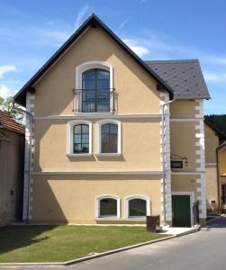 a house with a balcony on top of it at Old House in Hradec nad Moravici