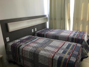 Vuode tai vuoteita majoituspaikassa Apartamento 601 3 Dormitórios