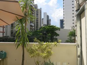 a view of the city from a balcony at Hospedagem Casa Paulista in Sao Paulo