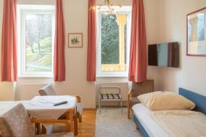Postel nebo postele na pokoji v ubytování Hotel & Hostel Sandwirt