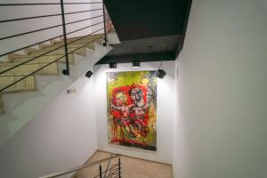 a painting of a man on a wall with a skateboard at 1st World NFT Block & Art Capsule Hostel MetaCHORS in Bratislava